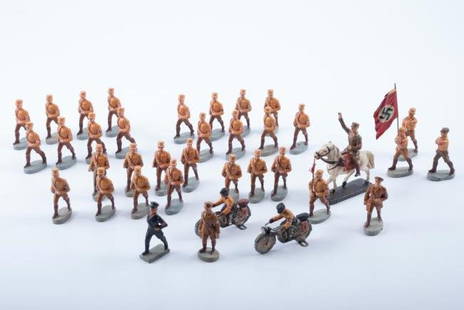 O&M Hausser Elastolin Nazi Soldiers: Approximately (35) O&M Hausser Elastolin Nazi Soldiers marching, on motorcycle, horseback and carrying banners and flags. Condition: Mostly good, break to arm of (1), repair to leg of horse.