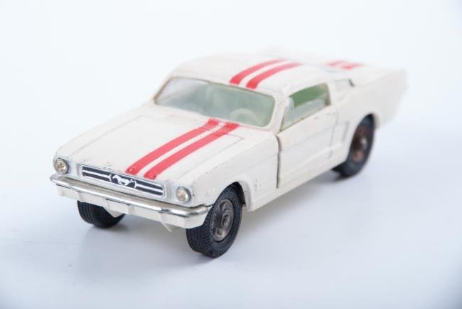 Corgi Toys Ford Mustang Fastback 2+2: Corgi Toys Ford Mustang Fastback 2+2. Duel racing strips painted. Condition: Good: Surface grime/ slight discoloring to white paint