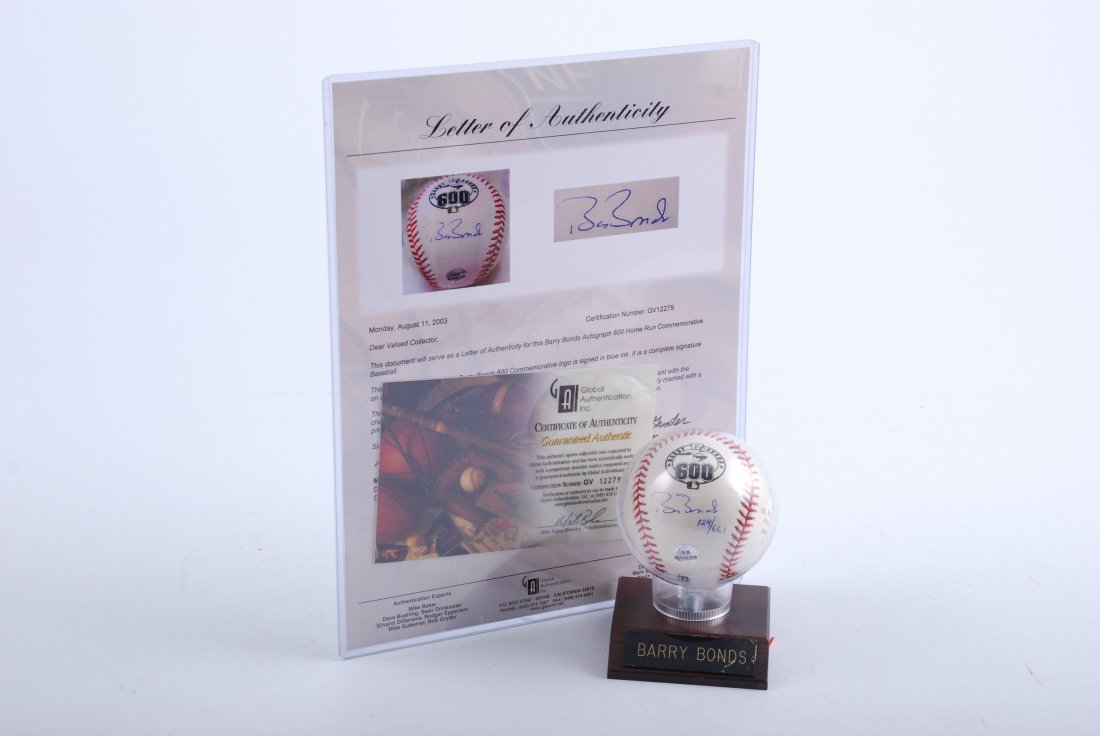 Barry Bonds Autographed Baseball.: Collectible ball celebrating home run number 661, surpassing baseball legend Willie Mays. Signed "Barry Bonds" and numbered 124/661. Comes with certificate of authenticity.