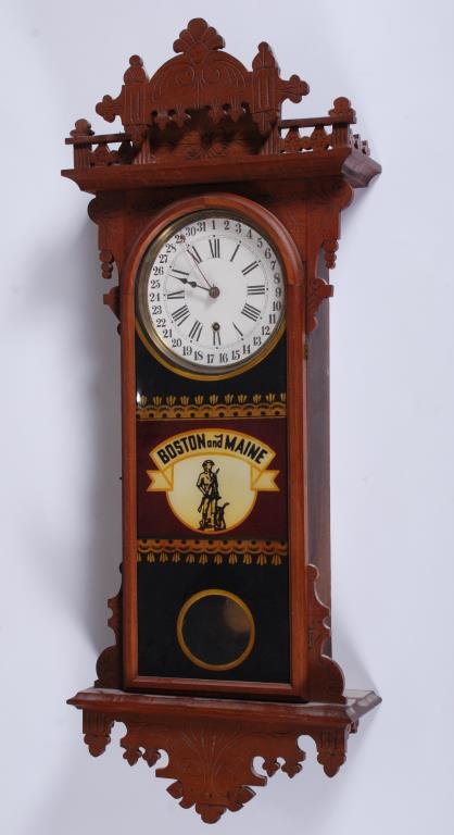 E.N. Welch Eclipse Calendar Wall Clock: Glazing with reverse print for the "Boston & Maine Railroad Railway". Originally from the Exeter, NH station. Height 38 1/2 inches. *Running Condition with 8 day movement. Condition: Totally restored