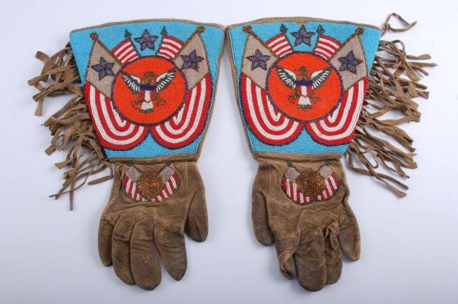 Native American Beaded Gauntlets with Fringes: Wild west era Native American Indian Gauntlets, beaded, Plateau style, cotton lined circa 1900. Fringed leather with beaded eagle "The Seal of the United States. Condition: Used but good condition