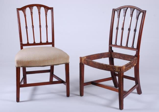 Pair of Federal Period Side Chairs Probably Salem: Carved Mahogany of Sheraton Design with carved back, bowed trapezoidal seat, molded legs and recessed "H" stretcher. 37 x 21 x 17 1/2 inches. Condition: (1) Upholstered seat absent, legs bumped and ni