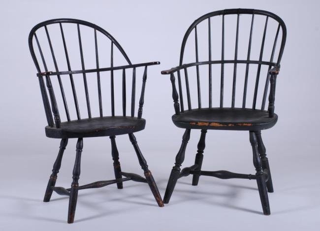 (2) Similar 18thc. Sack Back Windsor Armchairs: Each seven spindle black painted armchairs (1) with Barre and Sudbury labeled history. 38 x 23 x 20 inches and smaller Condition: Good estate condition, wear