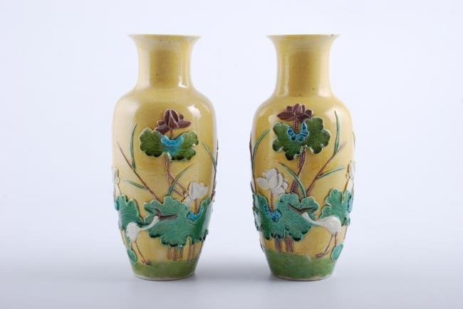 Pair of 19thc. Glazed Earthenware Chinese Vases: Depicting a pond with lily pads and cranes. unsigned. Height 9 1/2 inches each. Condition: Good, (1) vase with minute rim chip.