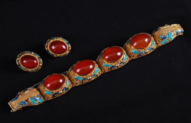 Carnelian and Vermeil Bracelet & Earring Set: Contemporary Asian sterling vermeil bracelet and clip earring set decorated with filigree and enamel set with cabochon carnelian Condition: Good Size: Approx. 6 7/8 inches long, earrings 7/8ths inch