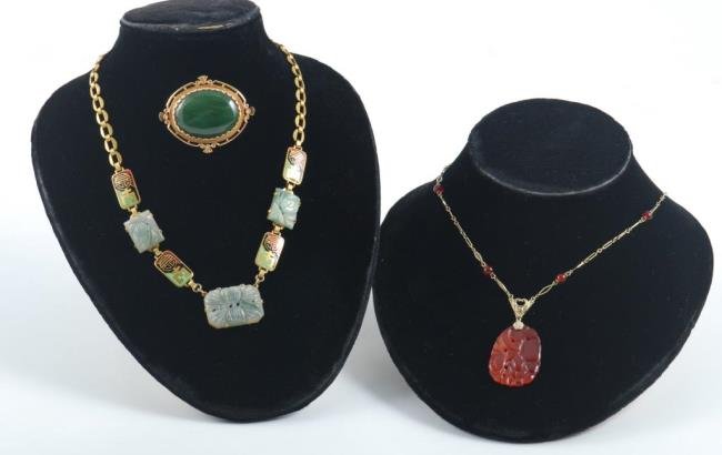 14K Gold Jade Pin with Art Deco Necklace: A 14K jade pin, a 14K art deco carnelian necklace and an enamel brass and jade art deco necklace Condition: Good Size: All approx: jade pin 1 1/2 inches across, carnelian necklace 15 3/4 inches long, 