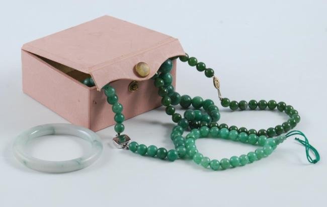 Jade Bracelet and Hard Stone Jewelry: A small jade bangle bracelet with 2 strands of green hard stone necklaces(smaller strand appears to be jade) and worry beads Condition: Good Size: Bracelet interior is approx. 6 1/4 inches