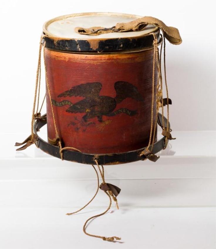 WM. R HOPKINS CIVIL WAR FIELD DRUM W/ EAGLE: Hand painted Patriotic Eagle holding, olive bow, arrows and E. Pluribus Unum banner on a red field. Period vellum drum heads. Signed interior Wm. R Hopkins in ink. Together with the original iron swiv