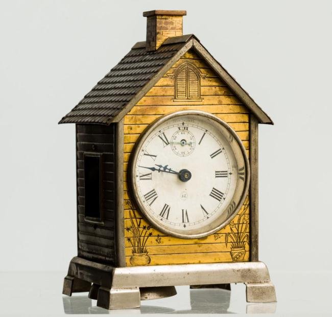 SETH THOMAS "LODGE" HOUSE FORM NOVELTY CLOCK: Gold gilt front, nickel plated frame and glass in sides. (1) Day lever, strike or time & alarm. (3) Inch dial. Height 7 1/2 inches