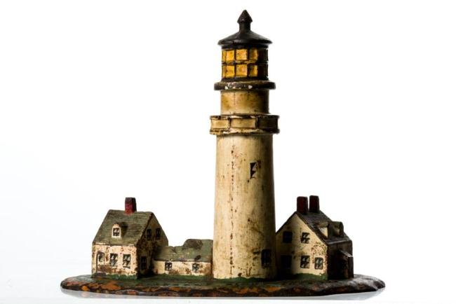 RARE "HIGHLAND LIGHT" CAPE COD CAST IRON DOORSTOP: 8 x 9 1/2 x 4 1/2 in.