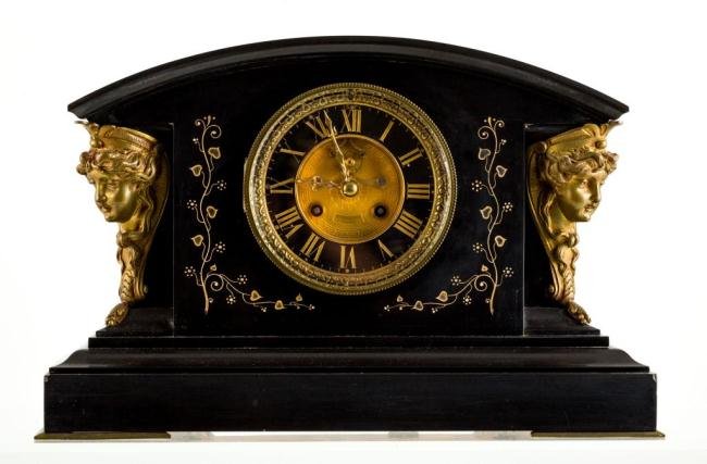 S. MARTI NEW YORK MARBLE MANTLE CLOCK: Dial gilt with gilt center inscribed Mann New York, gilt bronze ornament and engraved gilt marble case. (This clock closely resembles ""Henrietta"" by New Haven Clock Co.) 11 x 17 x 6 1/2 inches