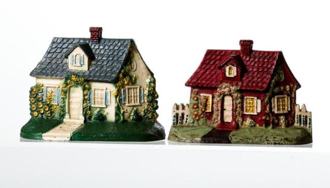 (2) COTTAGE DOORSTOPS IN (2) PAINT VARIATIONS: Height 5 5/8 in. Each
