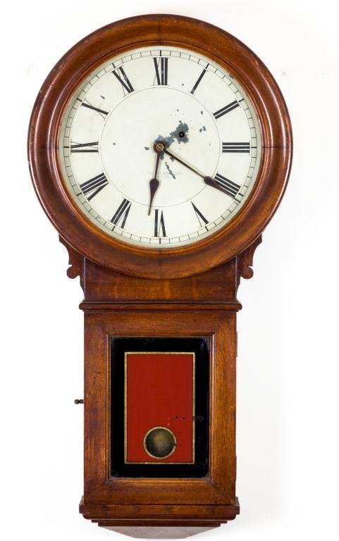 E. HOWARD CO. OF BOSTON OAK HANGING CLOCK: Regulator No. 70 hanging wall clock with 13 inch dial. Reverse painted tablet. Nice early finish. Height 31 inches