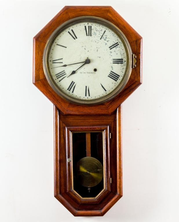 SETH THOMAS "GLOBE" HANGING CLOCK: In old oak polished veneer. This example has a clipped (or rounded) drop. Height 31 inches