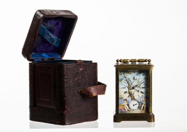 FRENCH AUIGUILLES CARRIAGE CLOCK W ENAMELED PANELS: Hand painted enameled dial and side panels adorn with romantic scenes. Case is signed "H.A. Brevete S.G.D.G." Original leather velvet-lined case retailed by Tilden Thurber, Providence, RI. 7 x 5 x 4 1