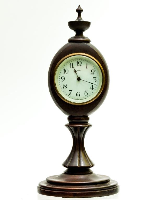 NEW HAVEN CLOCK CO. NOVELTY CLOCK: Wooden turned and carved case in the form of a post or sidewalk clock. 3 inch dial. Height 14 1/2 inches