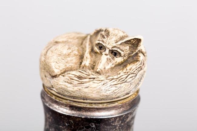 ENGRAVED FOX HUNT CANE WITH FOX: Knob handle surmounted by a curled-up composite fox. Metal ferrule. Length 36 inches