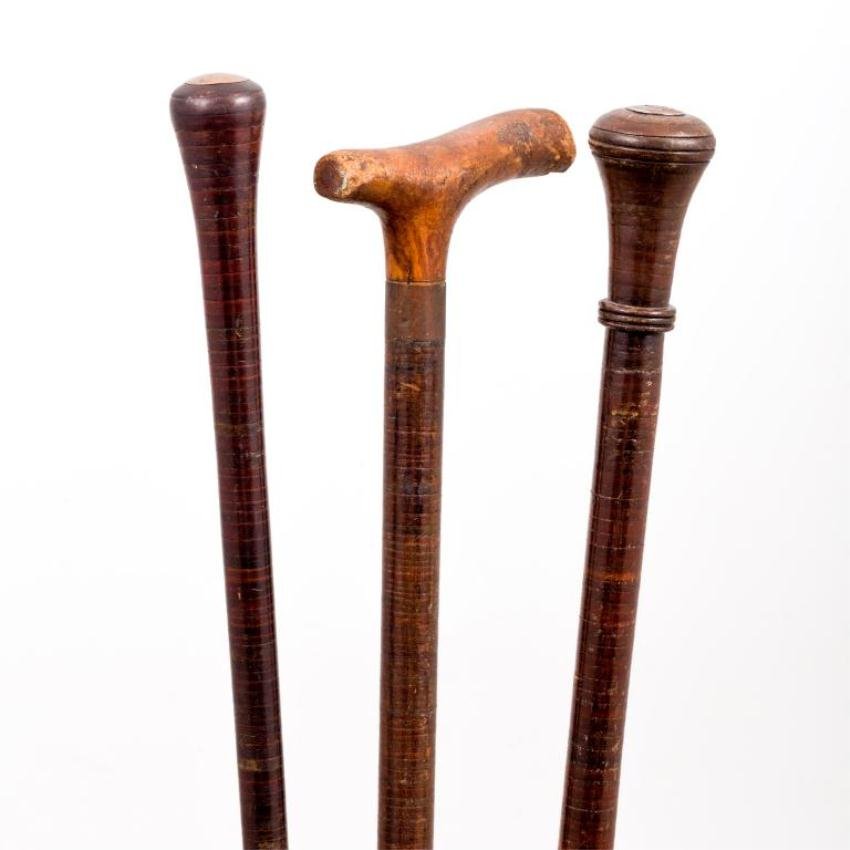 (3) LEATHER-WRAPPED SELF-DEFENSE CANES: (2) Knob handle and (1) burl wood ""Opera"" handle example. Brass and steel ferrules. 36 inches and under