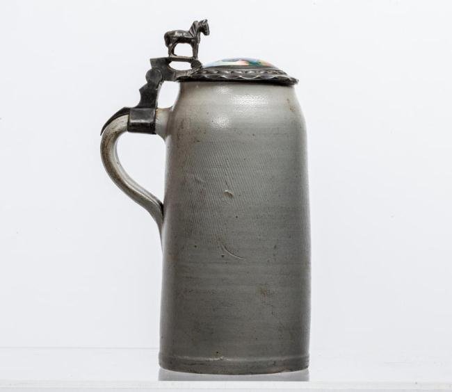 SALT GLAZED STONEWARE STEIN WITH PAINTED LID: (2) Liter stein. Pewter handle decorated with a pair of pewter horses and inlayed with a hand painted porcelain scene ""Des Frrlicht"". Height 12 inches