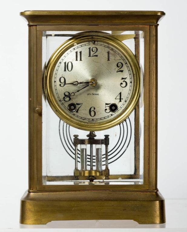 SETH THOMAS "EMPIRE" CRYSTAL REGULATOR: Rich gold finish, beveled glass, round corners on base and top. Height 9 3/4 inches