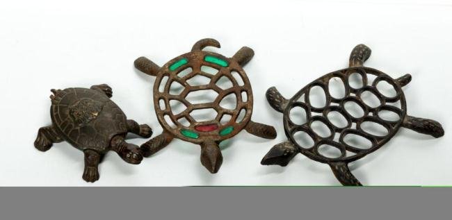 (2) CAST IRON TURTLE FORM TRIVETS & (1) MATCHSAFE: Length 8 in. & under