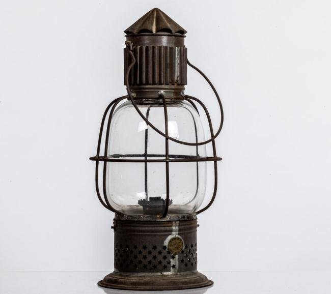 J.D. BROWN PIERCED &CORRUGATED TIN LANTERN: Caged blown molded globe, star pierced cupped base, corrugated vents and swing handle. Patented May 29, 1860 Height 15 inches