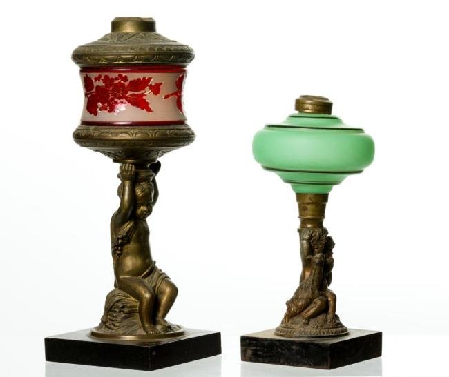 (2) FROSTED GLASS FLUID LAMPS W/ FIGURAL STANDARDS: Each have blown molded acid etched fonts with bronze painted white metal caryatid standards, marble and iron bases. Height 13 1/2 & 10