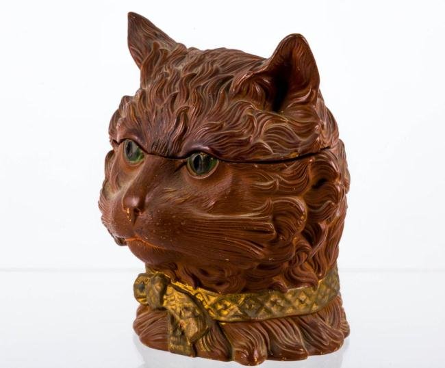 CERAMIC TOBACCO JAR IN THE FORM OF A CAT: Signed "F.G.W." Height 7 1/2 inches