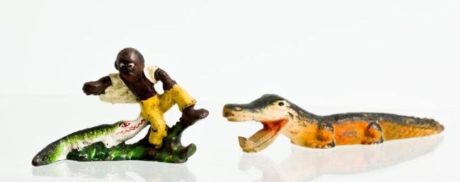 BLACK AMERICANA CAST IRON BOTTLE OPENER & GATOR: Hand painted figural bottle opener of a man being bitten by an alligator and a second example of an alligator. 6 inches and under