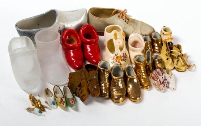 COLLECTION OF CERAMIC, GLASS AND LEATHER SHOES: Over (25) examples. Length under 5 inches