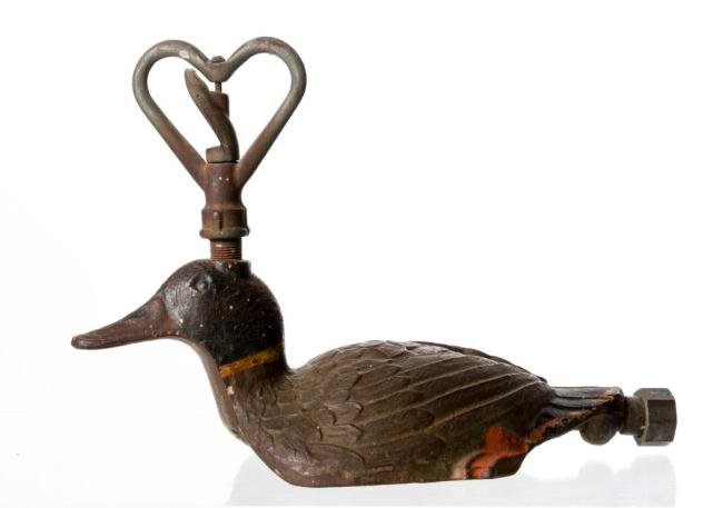 CAST IRON DUCK-FORM LAWN SPRINKLER: 9 x 13 inches