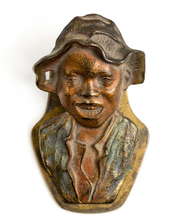BLACK AMERICANA FIGURAL BRASS WALL CLIP: Cold painted brass wall clip with spring. Embossed 5247 on back. Height 4 1/4 inches