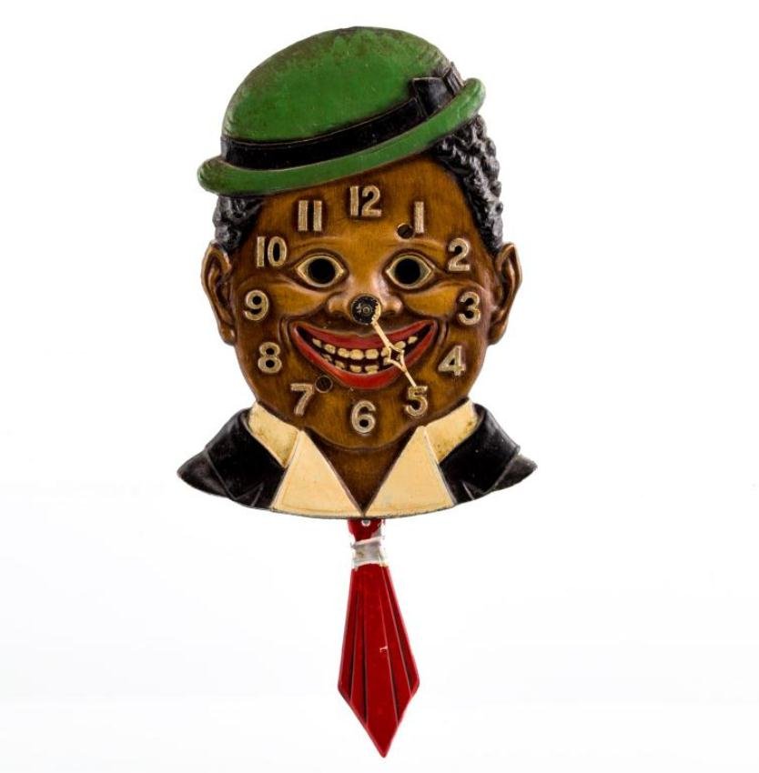 BLACK AMERICANA FIGURAL NOVELTY WALL CLOCK: Lux Clock MFG Co. Inc. Waterbury, CT. Eyes and tie sway with movement. Height 8 inches