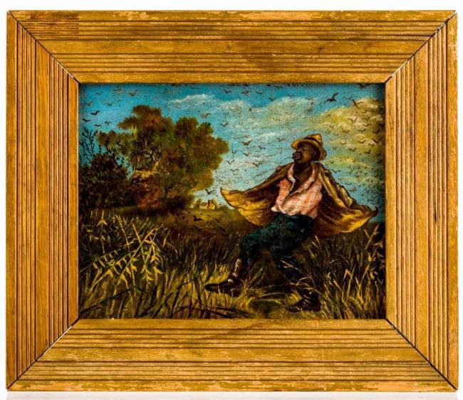 BLACK AMERICANA PAINTING OF MAN PROTECTING CROPS: A particularly successful late 19th c. folk art oil on board of an African American protecting his crops from birds. The figure is well executed by a naïve hand. unsigned. framed. 7 x 9 inches.