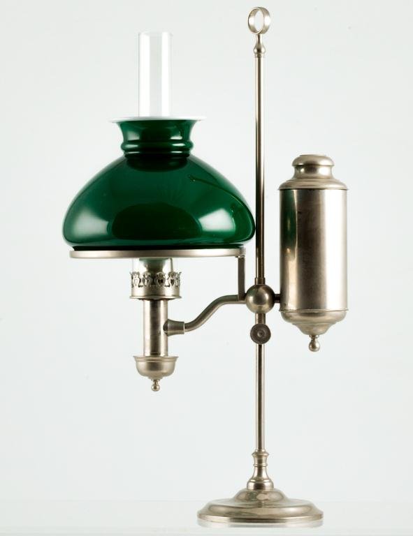 NICKEL-PLATED STUDENTS LAMP: Traditional green over white cased dome shade. The adjustable lamp is dated with a series of Patents on the top of font. The last being Dec. '77. 7 inch fitter. Height 21 inches to top of stand ring.