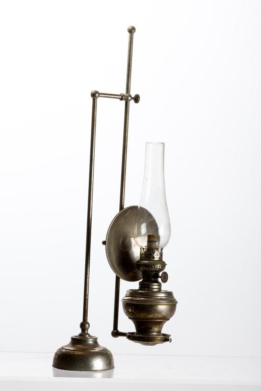 EDWARD MILLER & CO. "BOUDOIR" LAMP: Over hanging nickel plated lamp with heavy weighted base that supports an adjustable rod system to suspend lamp. It has an adjustable reflector. This lamp most likely was used on an upright piano. Lam