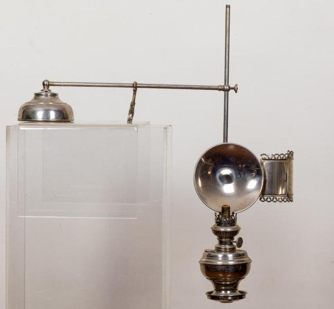 E. MILLER & CO. "THE BOUDOIR" PORTABLE SCONCE: Over hanging nickel plated lamp with heavy weighted base that supports an adjustable rod system to suspend lamp. It has (2) adjustable reflectors. This lamp most likely was used on an upright piano. 2