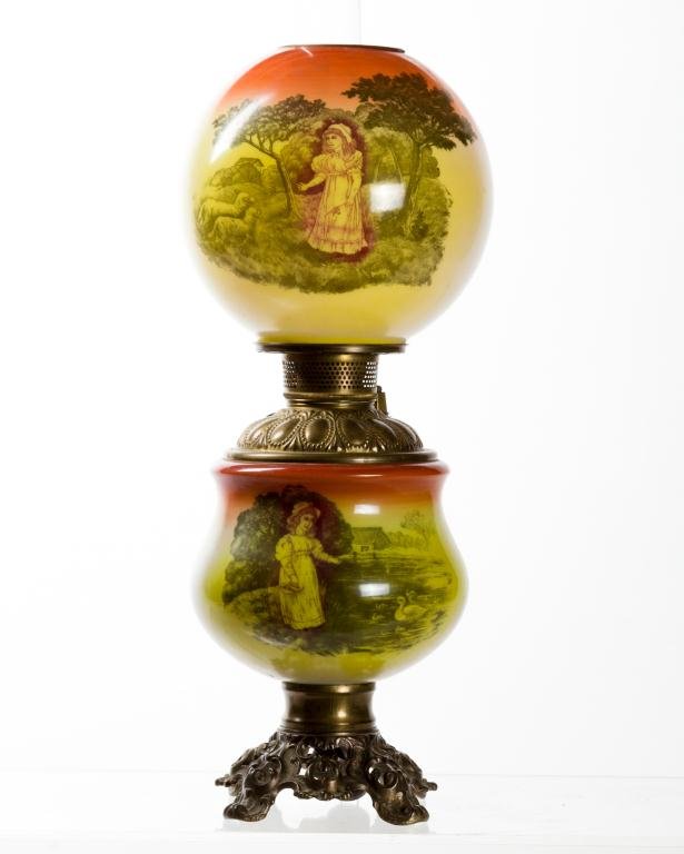 GONE WITH THE WIND PARLOR LAMP: Both shade and base have transfer decorated scenes of a girl with sheep on orange and yellow painted ground. Drop-in font electrified. Globe 8 1/2 inches. unmarked. Height 21 inches