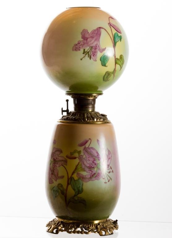 GONE WITH THE WIND PARLOR LAMP: Lily decorated milk glass shade and base with peach, pink and green background. 10 inch ball shade. Electrified drop-in font. Height 25 inches