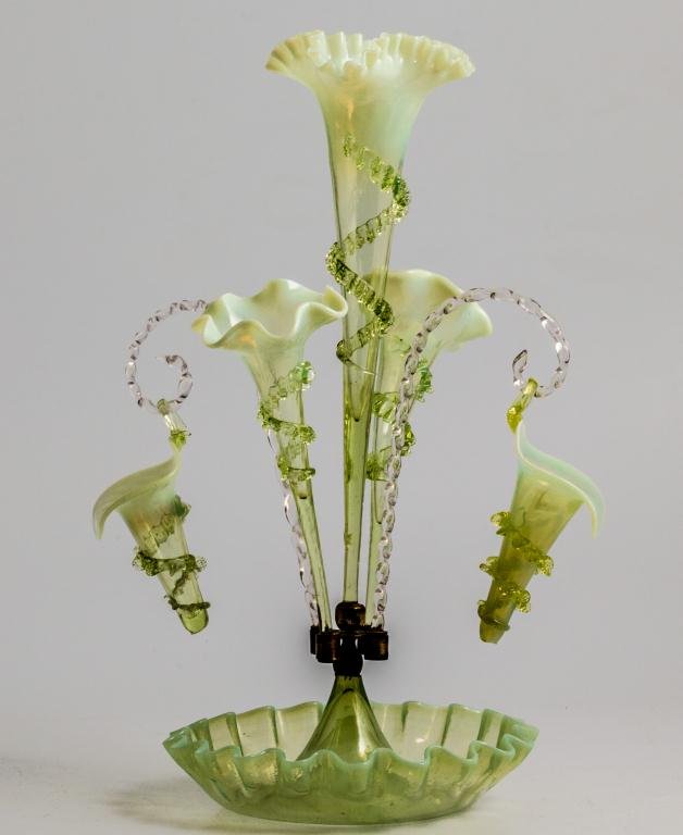 GREEN & OPALESCENT GLASS FLOWER EPERGNE: Multiple bouquet epergne with center trumpet-form lily vase, (2) outwardly tipping lily vases and (2) basket lilies hang from rope-twisted canes. Attached to center bowl with brass center holder. 20 x