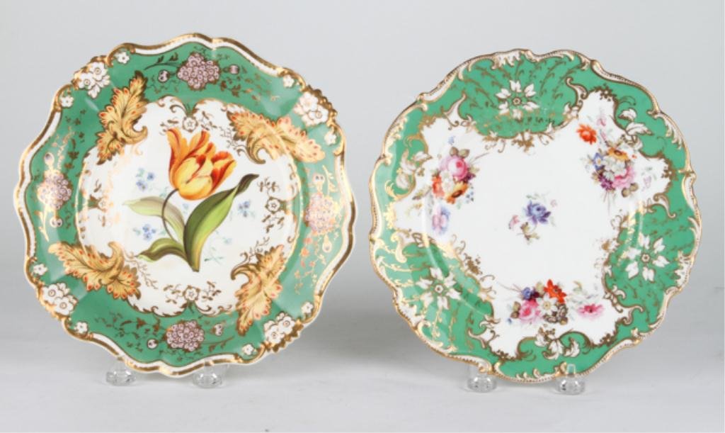 (2) (19thc.) Hand Painted Soft Paste Plates: Gold luster highlights and hand painted floral motifs on white ground and green border. 9 inch diameter each. Condition: Good, surface grime.