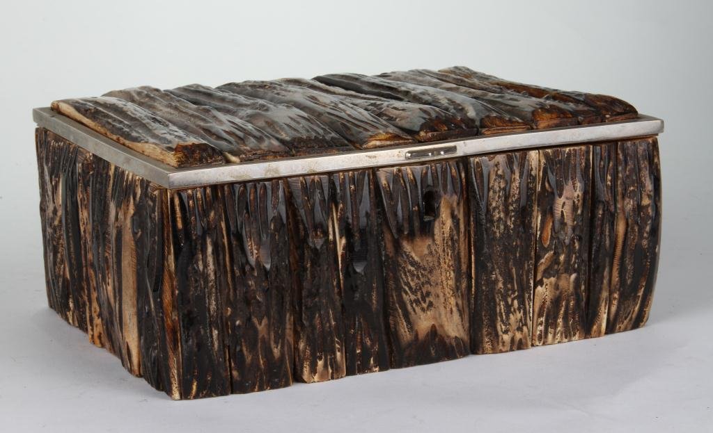 (Early 20th c.) Gucci Cigar Box: Antler veneered cherry cigar box with nickel lid. Original label. 3 1/2 x 8 1/2 x 6 1/2 inches. Condition: Good, key absent