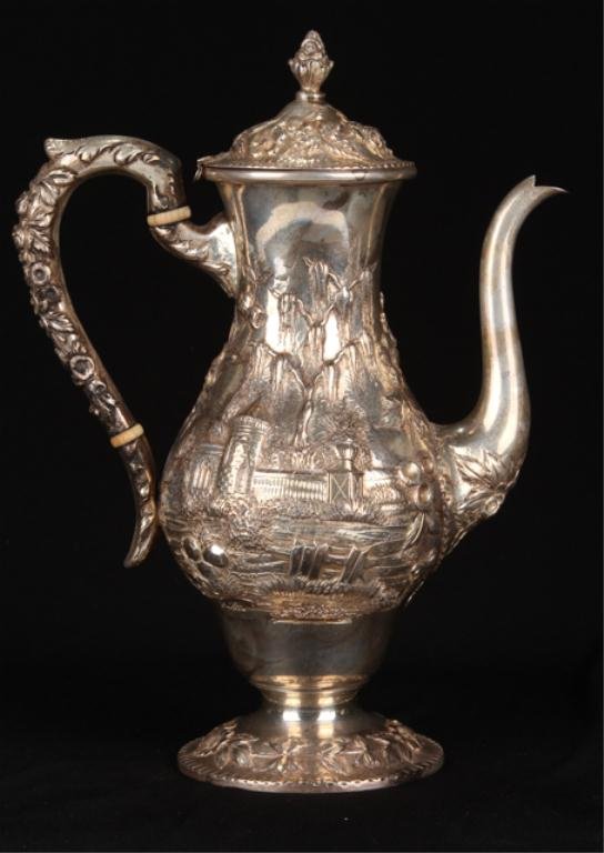 S. Kirk & Son Co. Sterling Silver Chocolate Pot: Hand chased repousse sterling silver pot with Renaissance revival landscape and floral motif. Height 9 3/4 inches. Condition: Lid missing original hinge pin.