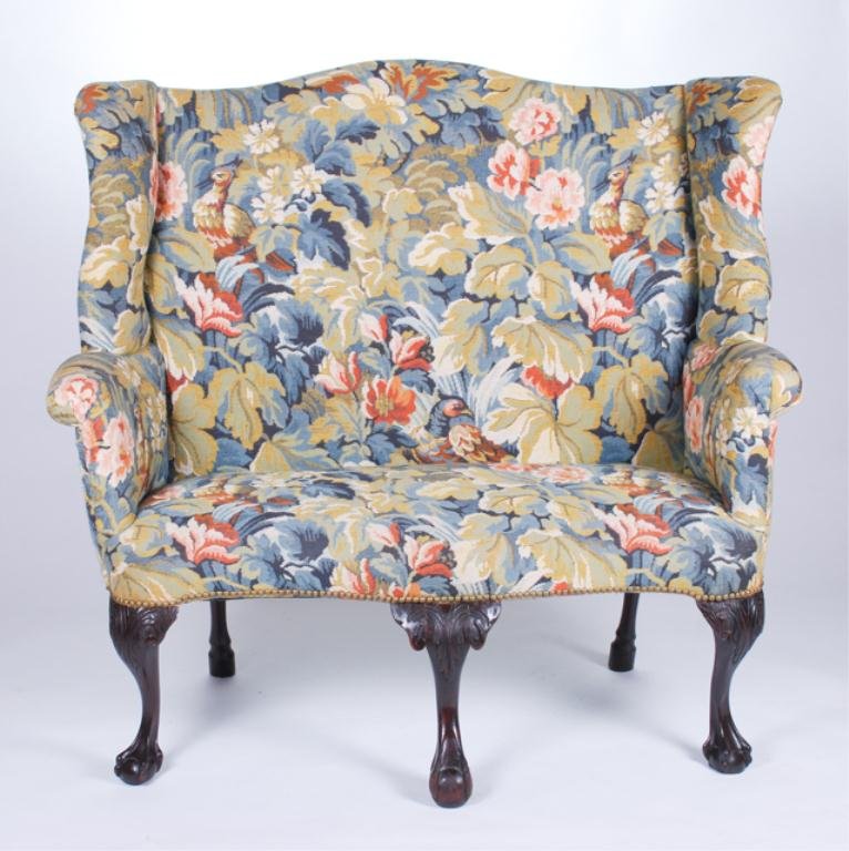 Chippendale Style High Backed Upholstered Settee: Acanthus leaf carved legs with ball and claw feet with (18th c.) appropriate upholstery. 47 x 48 x 21 inches