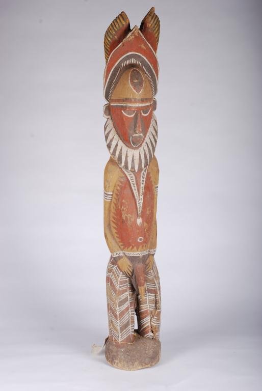 (Mid 20th c.) Papua New Guinea Ritual Figure: Carved and painted wood. Height 38 inches. Gallery Primitive Cairns, Australia tag attached. Condition: Even wear