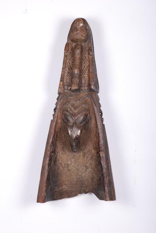 Canoe Bow Carving Possibly Papau New Guinea: Wooden fragment with bird and geometric motifs. Height 25 inches. Condition: Wear, bottom edge is chipped