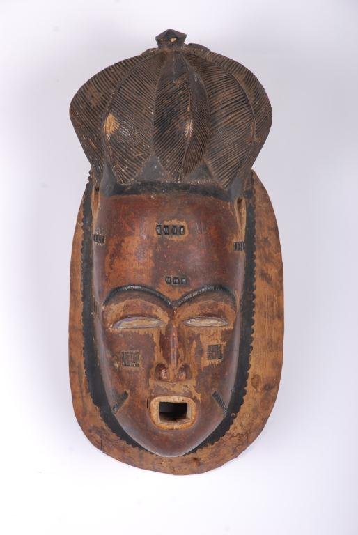 (19th/20th c.) West African Baule Tribal Mask: Carved and painting wood. Height 16 inches. Condition: Wear, repair to base.