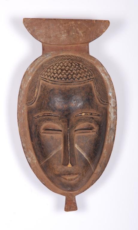 (Mid 20th c.) West African Baule Mask: Carved and ebonized wood. Height 14 inches. Condition: Good, wear
