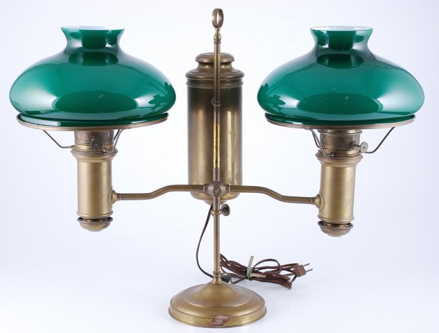 Miller Double Brass Students Lamp: (2) Green and white cased glass tam-o-shanter shades with 10 inch fitters. Height 22 inches (to top of center ring) Condition: Good, electrified, (1) shade ring is out of round