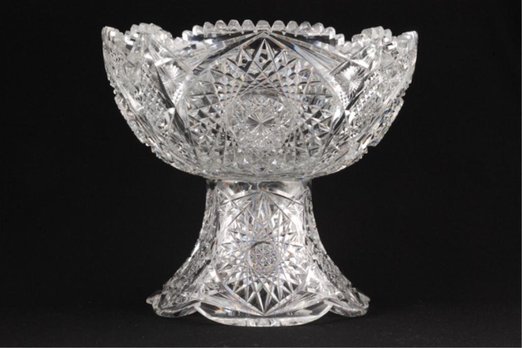 Extremely Heavy Cut Glass Punch Bowl on Pedestal: Two part cut glass punch bowl with foot. 11 x 12 inches. Condition: A few very small nicks/ruff spots on tips of serrated rim.